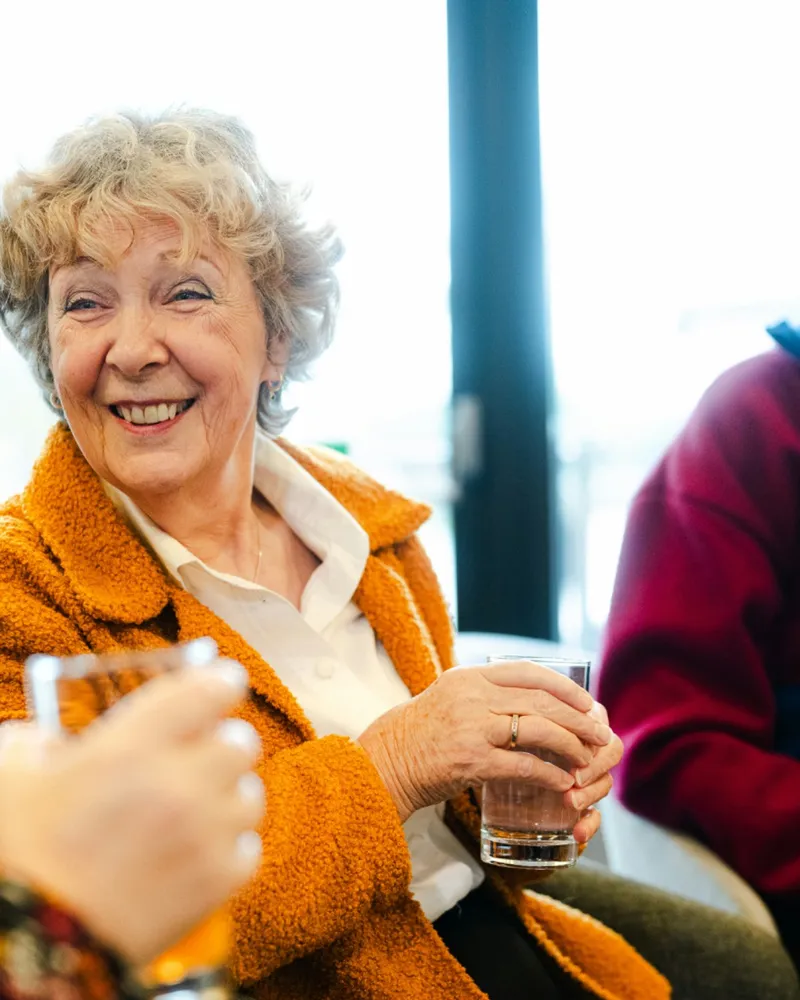Older adults chatting together at a Bright Hour gathering
