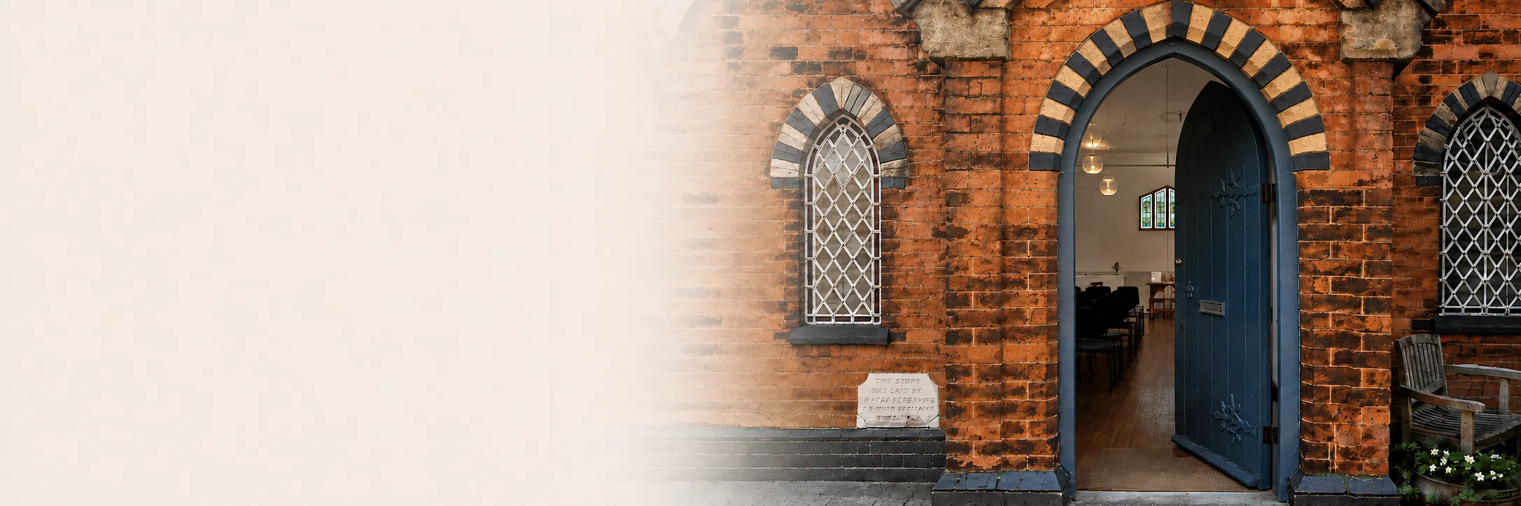 The open blue door and arched brick doorway at Water Orton Methodist Church