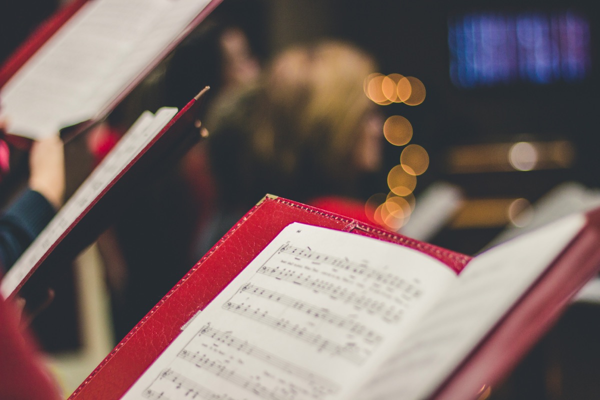 Open music books during Christmas carol singing