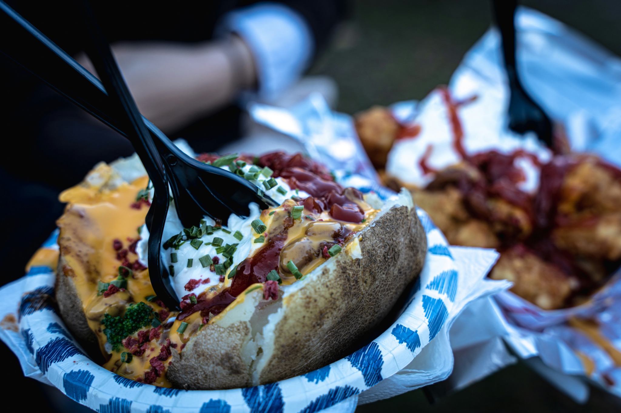 Loaded baked potato served as part of a community meal