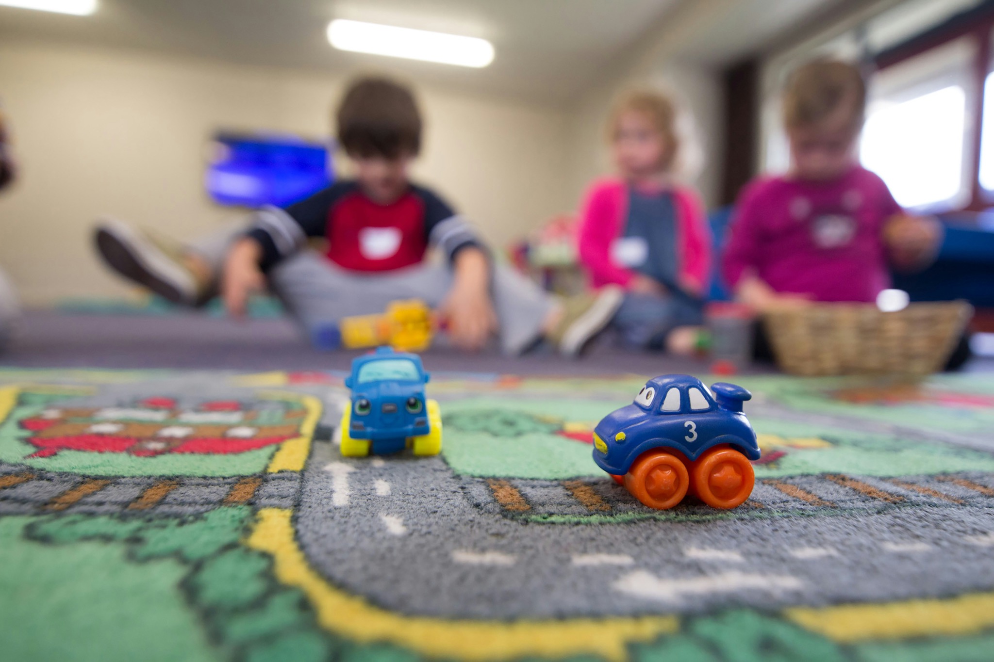 Children playing with toys during an activity